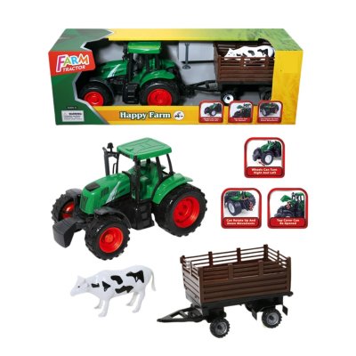 Grønn traktor med tilhenger og en søt ku